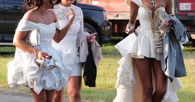 A group of glamorous racegoers swap their high heels for flip flops as they leave Ladies Day at Ascot