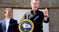 California Gov. Gavin Newsom discusses President Donald Trump's tariffs, as California Attorney General Rob Bonta, left, listens, during a press conference on Wednesday, April 16, 2025, at an almond farm in Ceres, Calif. (AP Photo/Noah Berger)