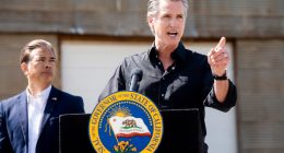 California Gov. Gavin Newsom discusses President Donald Trump's tariffs, as California Attorney General Rob Bonta, left, listens, during a press conference on Wednesday, April 16, 2025, at an almond farm in Ceres, Calif. (AP Photo/Noah Berger)