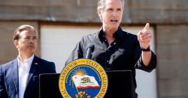 California Gov. Gavin Newsom discusses President Donald Trump's tariffs, as California Attorney General Rob Bonta, left, listens, during a press conference on Wednesday, April 16, 2025, at an almond farm in Ceres, Calif. (AP Photo/Noah Berger)