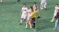 Incredible scenes as Brazilian football match descends into mass brawl with Military Police called after linesman lashed out at teenage player