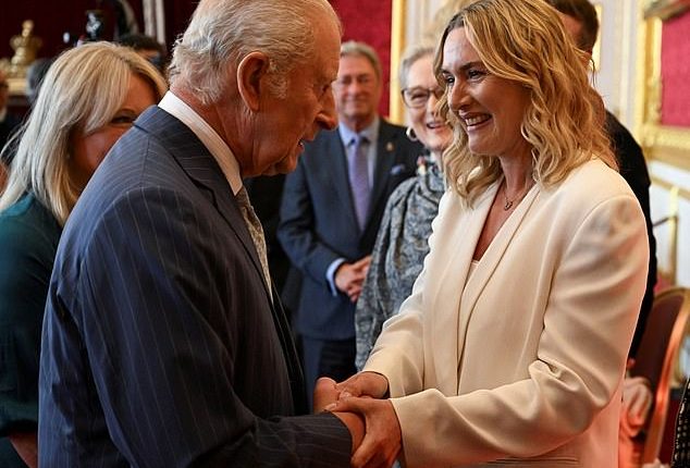 Kate Winslet has accepted a new position as part of the King's Trust - after claiming that she would be 'upset and disgusted' if she had come from 'wealth or royalty' (pictured with King Charles during a reception at St James's Palace in London)