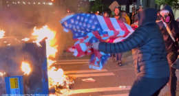 Man saves US flag from flames at anti-ICE protest in Seattle