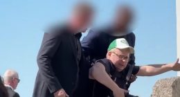Martin Odegaard's wedding descends into chaos as photographer is dragged AWAY by security guards - while Arsenal star marries Helene Spilling