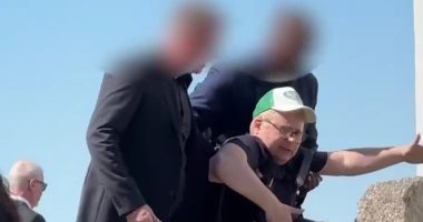Martin Odegaard's wedding descends into chaos as photographer is dragged AWAY by security guards - while Arsenal star marries Helene Spilling