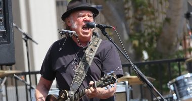 Neil Young's 'awkwardness' has gone down 'very badly' behind-the-scenes at Glastonbury, insiders tell KATIE HIND, as they reveal why his Hollywood bombshell wife Daryl Hannah is expected to skip the festival