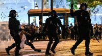 PSG 'barbarians' tear Paris apart: 294 arrested and 205 people injured, with a 17-year-old killed, in Champions League celebrations... as city braces for more chaos at tonight's parade