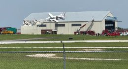 Small plane crashes onto hangar roof at Kansas airport