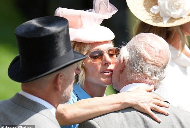 Zara Tindall pecks the King on the cheek as she warmly greets her uncle at Royal Ascot
