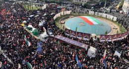 Thousands of Iranians attend a funeral procession.