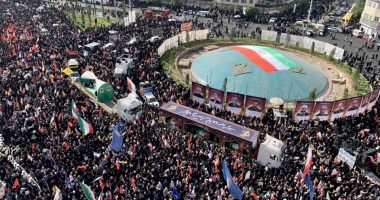 Thousands of Iranians attend a funeral procession.