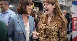 Rachel Reeves and Angela Rayner smiling and holding hands.