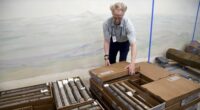 Geologist James Hagadorn closes boxes of core rock samples at the Denver Museum of Nature & Science on July 9, 2025. (AP Photo/Thomas Peipert)