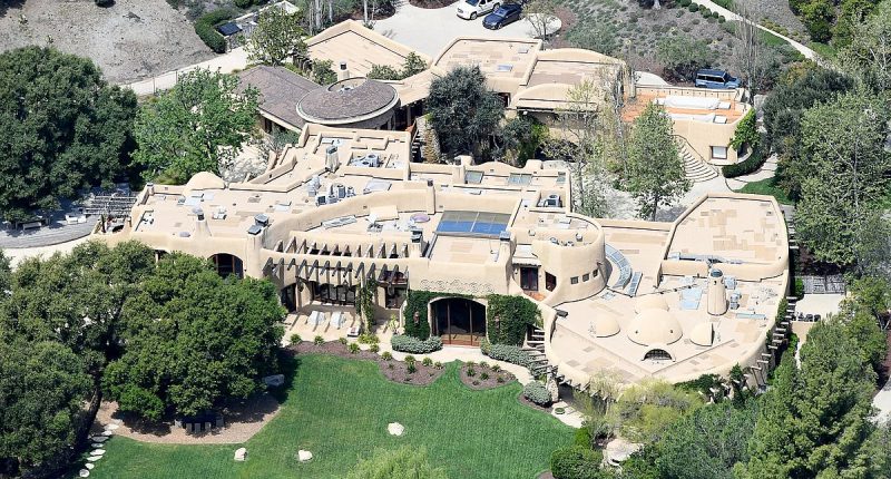 A-lister mansion that takes up a ZIPCODE... with mysterious symbols