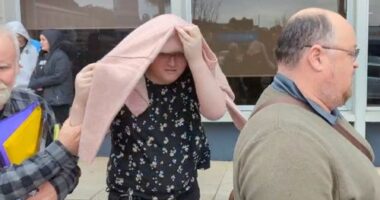 Birdie Kingston covering her face after her case was briefly heard at Penrith Local Court in Sydney, Friday, July 18, 2025.