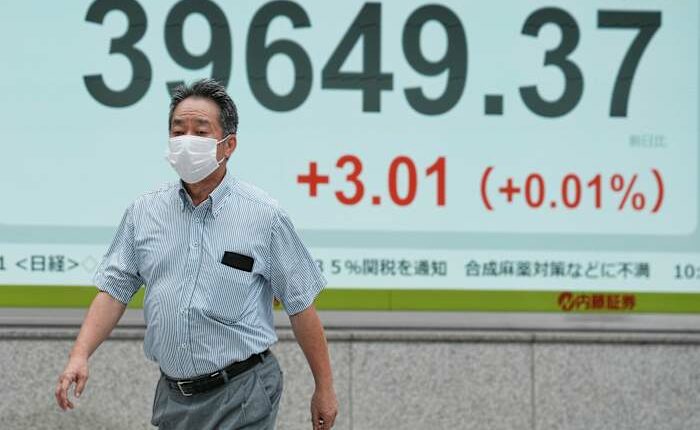 Asian shares are mixed after Wall Street closes higher and edges to more records