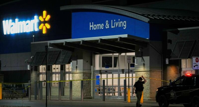Law enforcement officer at a Walmart crime scene.