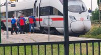 Passengers and first responders at an ICE train following an axe attack.