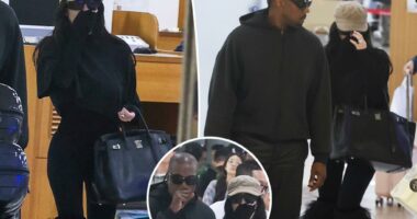 Bianca Censori totes a Birkin bag at the airport with Kanye West