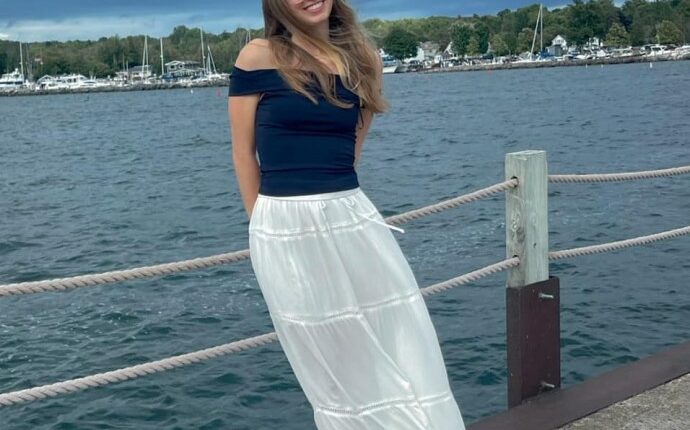 Eliotte Heinz, a missing graduate student, on a pier by the water.