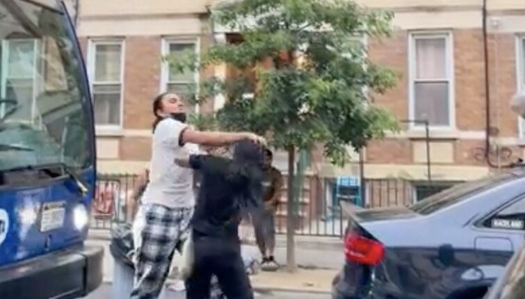 Street brawl between several women over a parking spot.