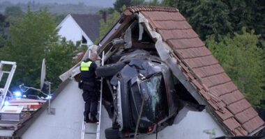 Car crashes into barn roof in Germany, seriously injuring two people