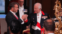 King Charles III and Emmanuel Macron toasting.