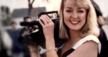 Photo of Jodi Huisentruit holding a video camera.