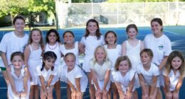 Group of girls in white dresses posing for a photo.