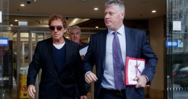 Australian musician Ian Moss (left) leaves the John Maddison Tower Courts with his lawyer Paul McGirr in Sydney, Tuesday, July 8, 2025. (AAP Image/Nikki Short) NO ARCHIVING