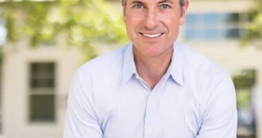 Portrait of a man smiling.