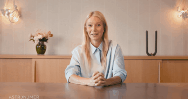 Gwyneth Paltrow sitting at a table.