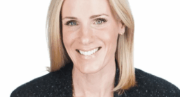 Headshot of a smiling woman with blonde hair.