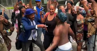 Diddy fans removed by riot police after spraying baby oil