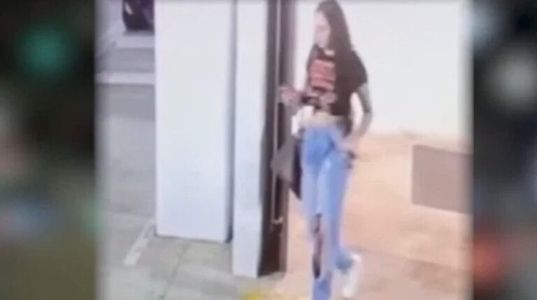 Surveillance video still image of Mercedes Vega in a parking garage.