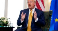Donald Trump speaking at a meeting.