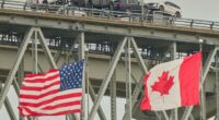 A truck carrying vehicles crosses the Blue Water Bridge into the US from Sarnia, Ontario