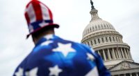 A pedestrian wearing a US flag-themed costume outside the US Capitol in Washington on July 2 2025