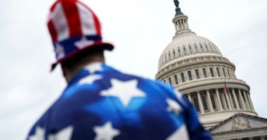 A pedestrian wearing a US flag-themed costume outside the US Capitol in Washington on July 2 2025