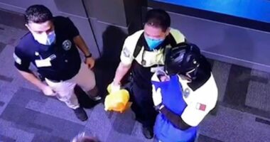 CCTV footage of authorities in Qatar holding a baby found in a toilet bin at Hamad Airport.