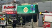 Firefighters responding to a fire at Singas Famous Pizza.