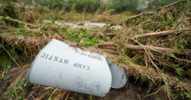 Damaged Camp Mystic mailbox in flood debris.