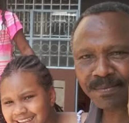 Photo of a man and his granddaughter.