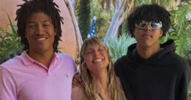Heidi Klum is dwarfed by sons Henry, 19, and Johan, 18