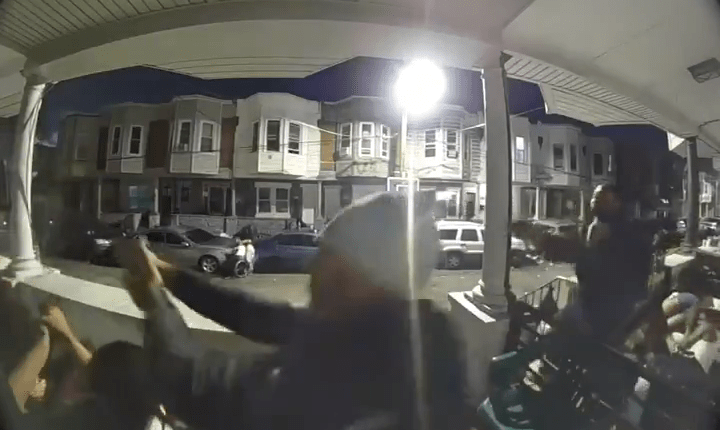 Security camera footage of a nighttime shooting.