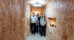 Family posing in their underground home in Coober Pedy, Australia.