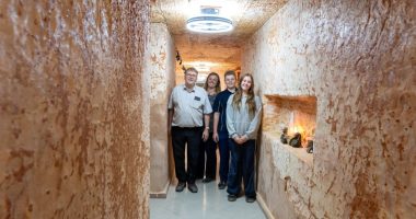 Family posing in their underground home in Coober Pedy, Australia.