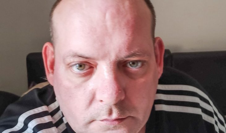 Close-up photo of Paul Davis, an AI scam victim.