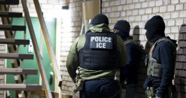 U.S. Immigration and Customs Enforcement officers wait to detain a person, Jan. 27, 2025, in Silver Spring, Md. (AP Photo/Alex Brandon, File)