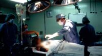 Surgeons performing surgery in an operating room.